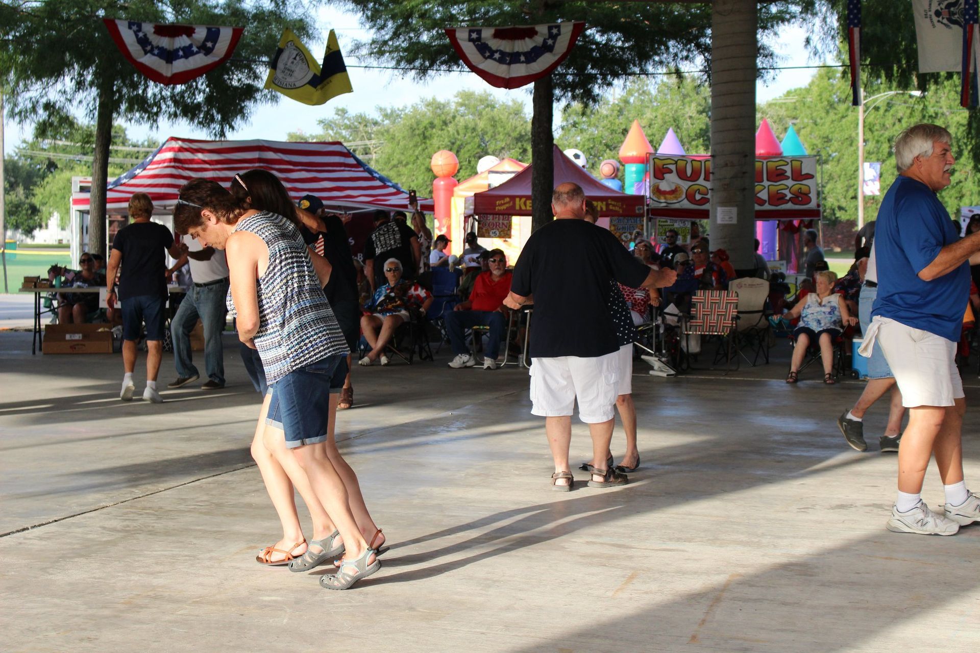 A group of people are dancing on a dance floor