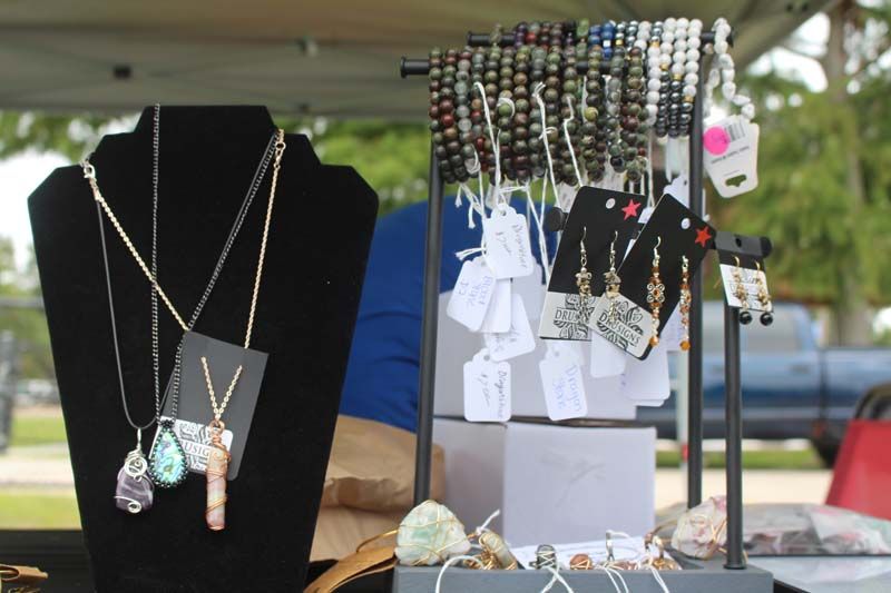 A display of necklaces and earrings on a table