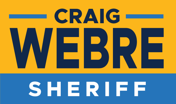 A yellow and blue logo for craig webre sheriff