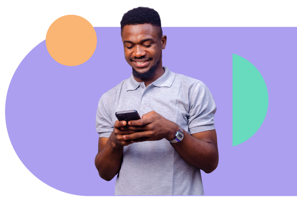 Smiling man in gray polo shirt using a smartphone against a purple backdrop with geometric shapes.