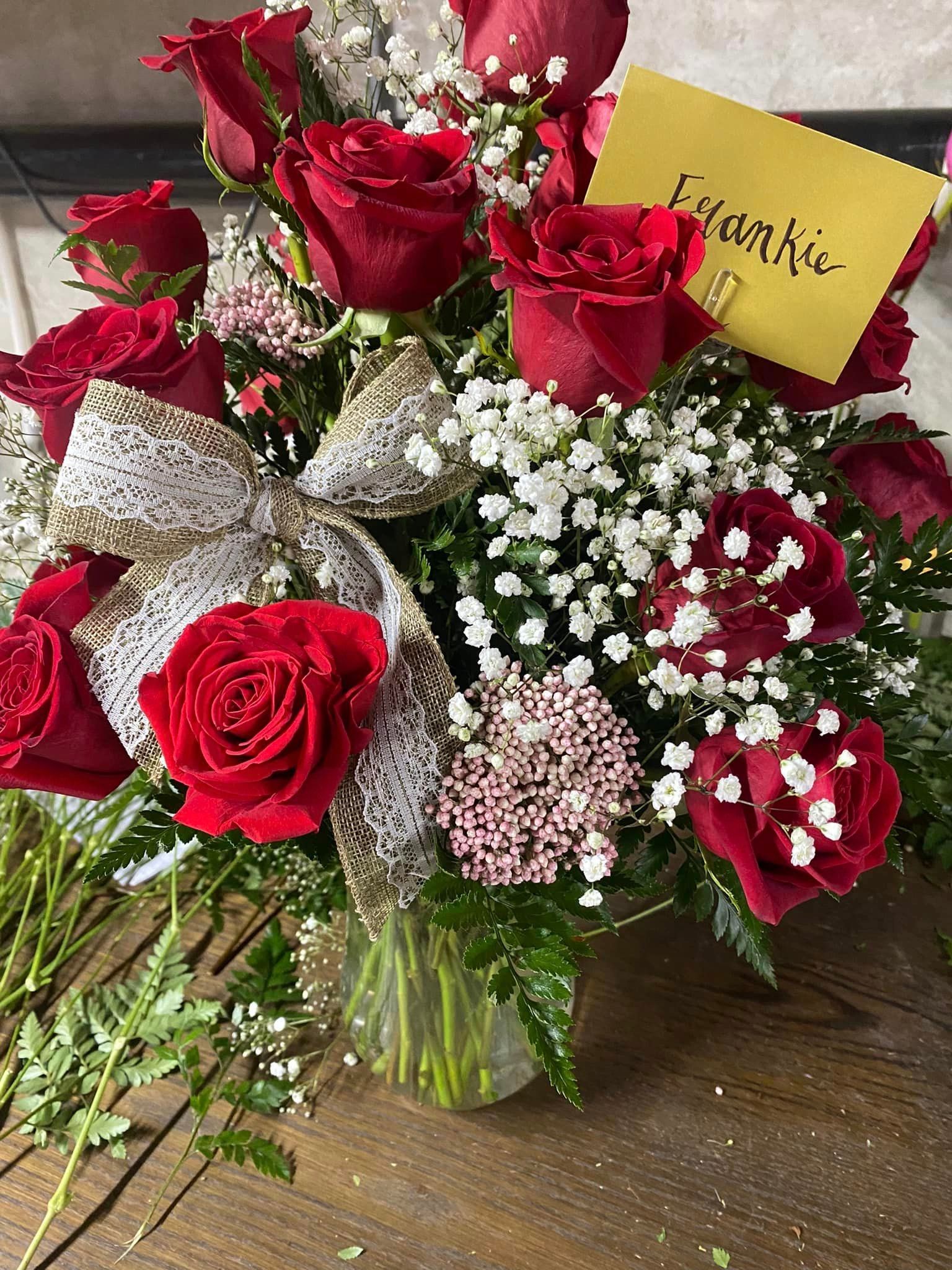 A Man and Woman Are Holding a Bouquet of Flowers — Tabernacle, NJ — Bees & Blooms