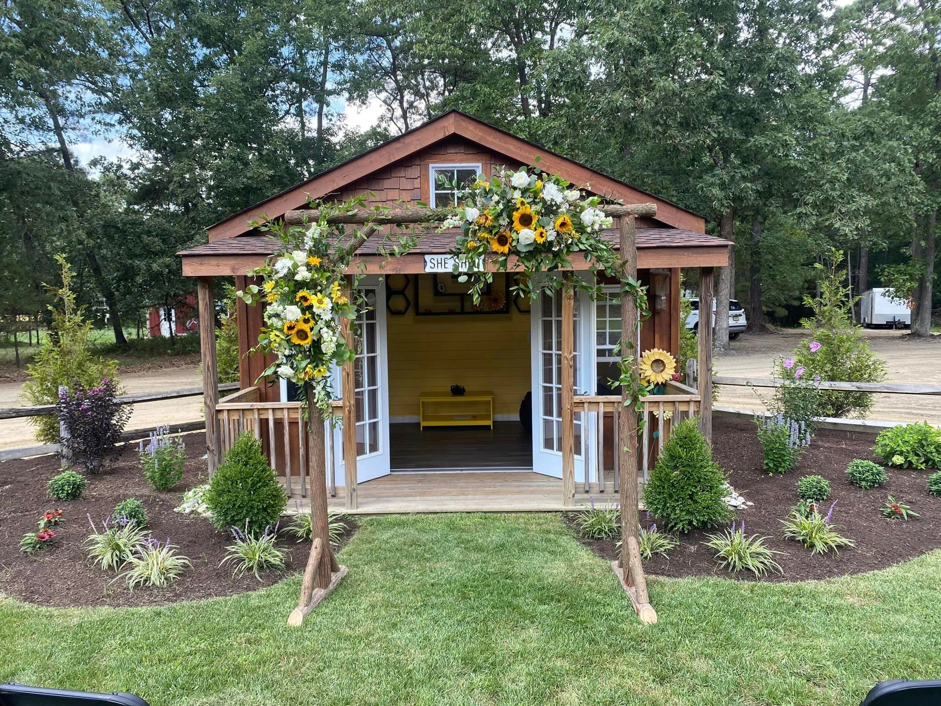 A table with flowers and candles on it and a sign that says Mr and Mrs