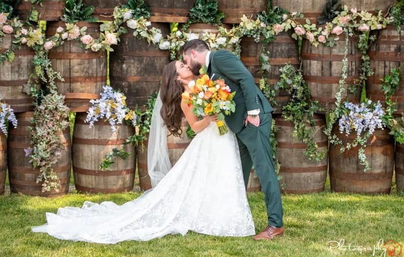 A small house is decorated with sunflowers and flowers for a wedding ceremony