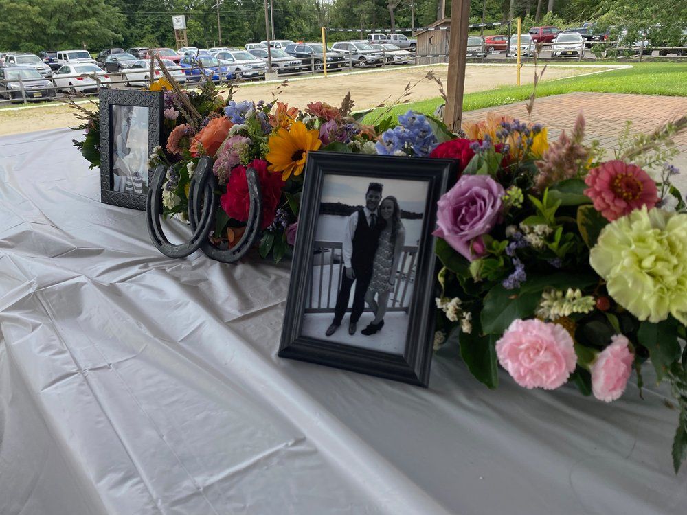 A Table with Flowers and A Picture of A Man and And Woman on It — Tabernacle, NJ — Bees & Blooms
