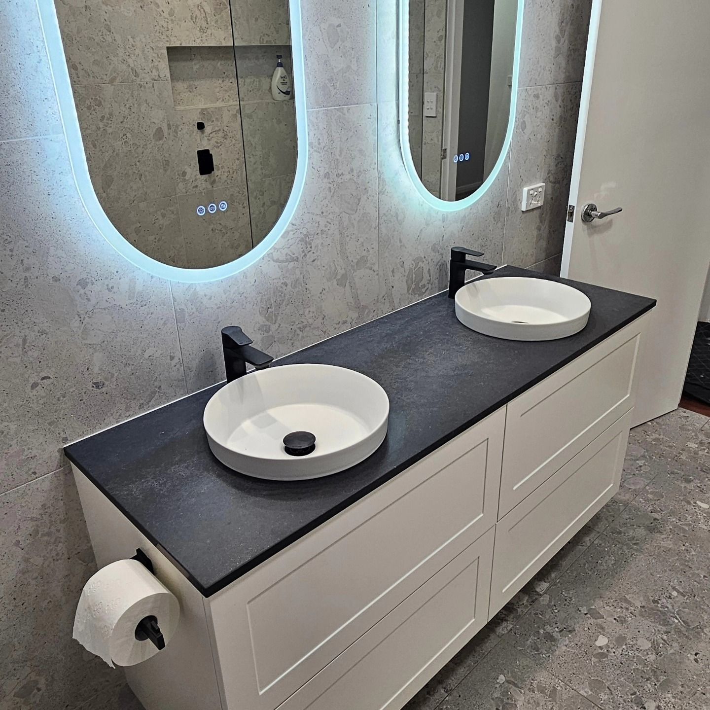 A Laundry Room With A Washer And Dryer — The Kitchen & Bathroom Doctor in Medowie, NSW