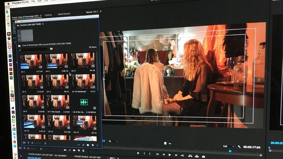 Video editing software showing a preview of two people in a warmly lit scene, with clip thumbnails on the left.