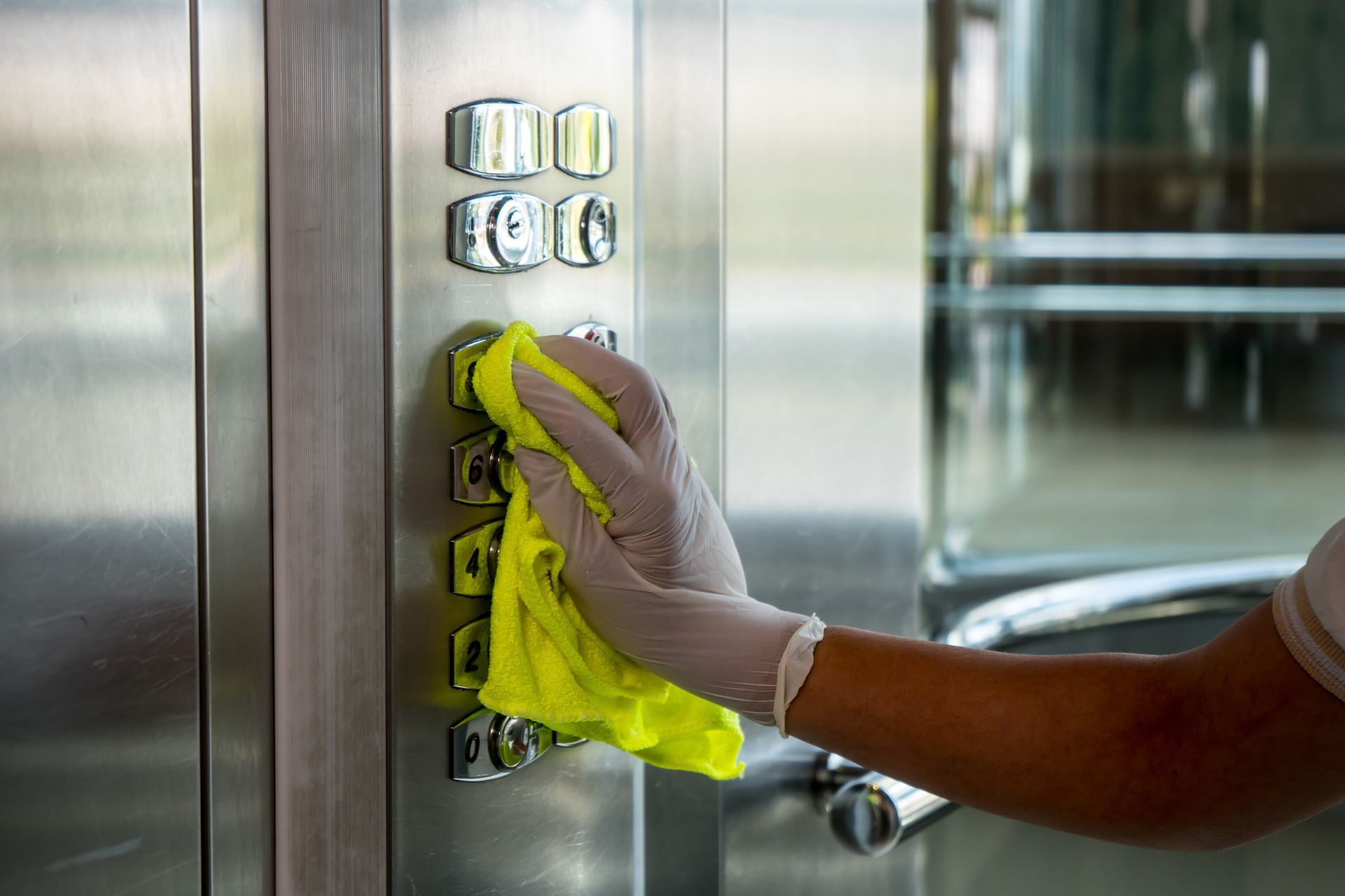 Cleaning elevator buttons