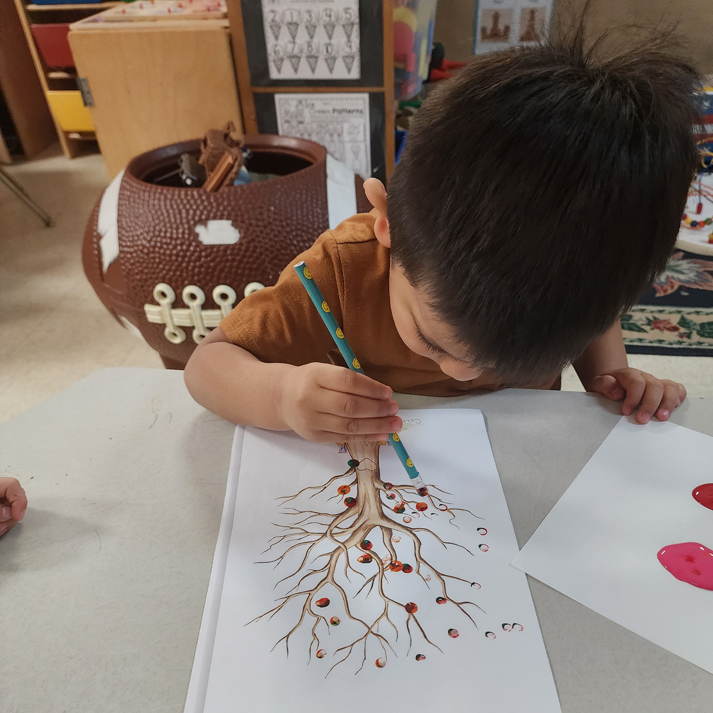 Summer Programs — A Boy Coloring a Tree in Columbus, OH