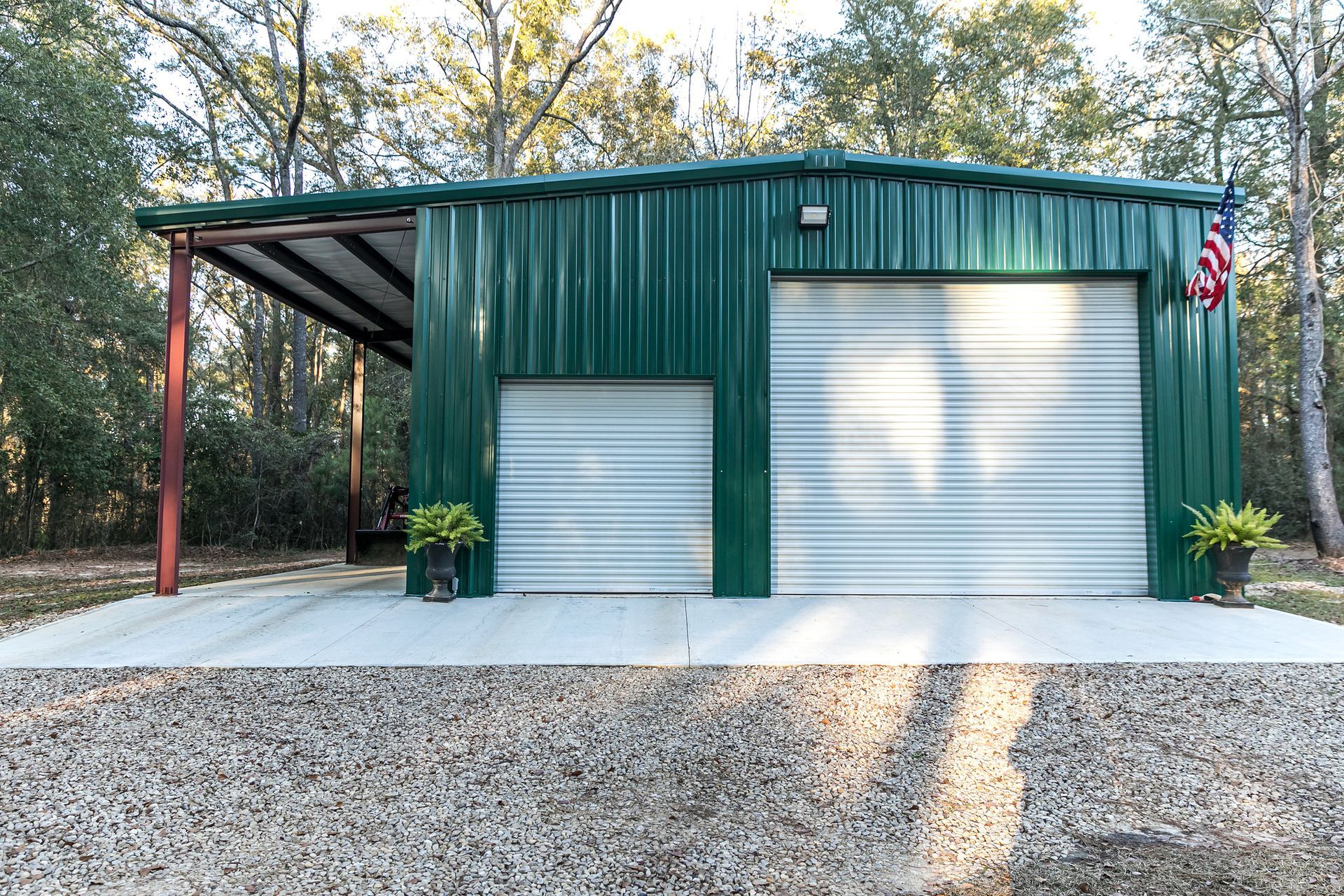 A large green outdoor metal building.