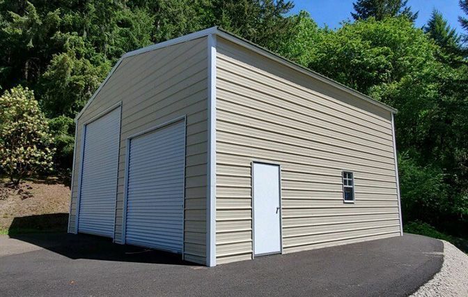 A garage with two garage doors and a white door.