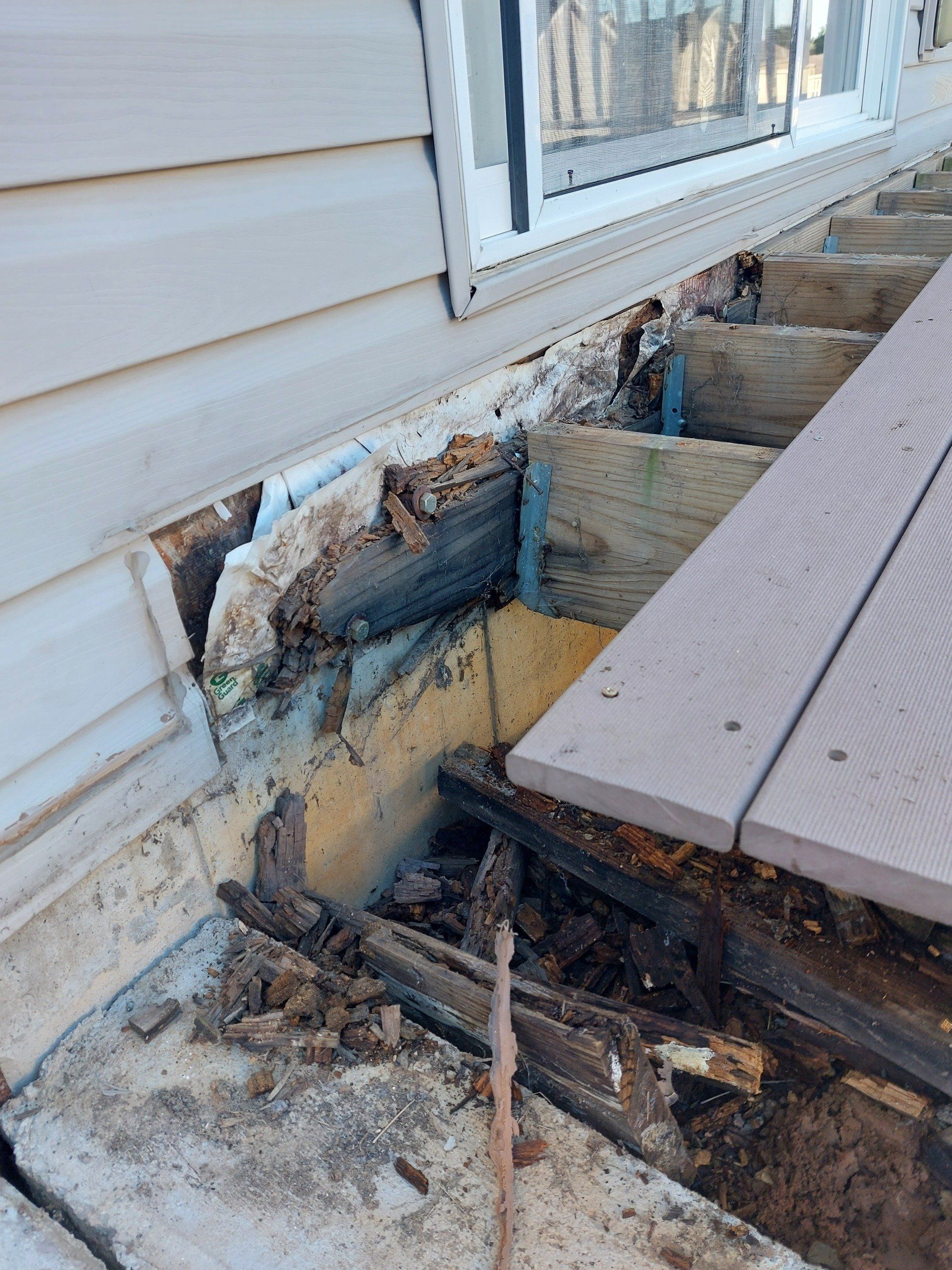 Deck being placed onto wall — Fenton, MO — SRP Home Improvement