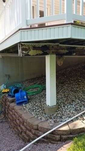 Deck on top of pile of rocks and stone wall — Fenton, MO — SRP Home Improvement