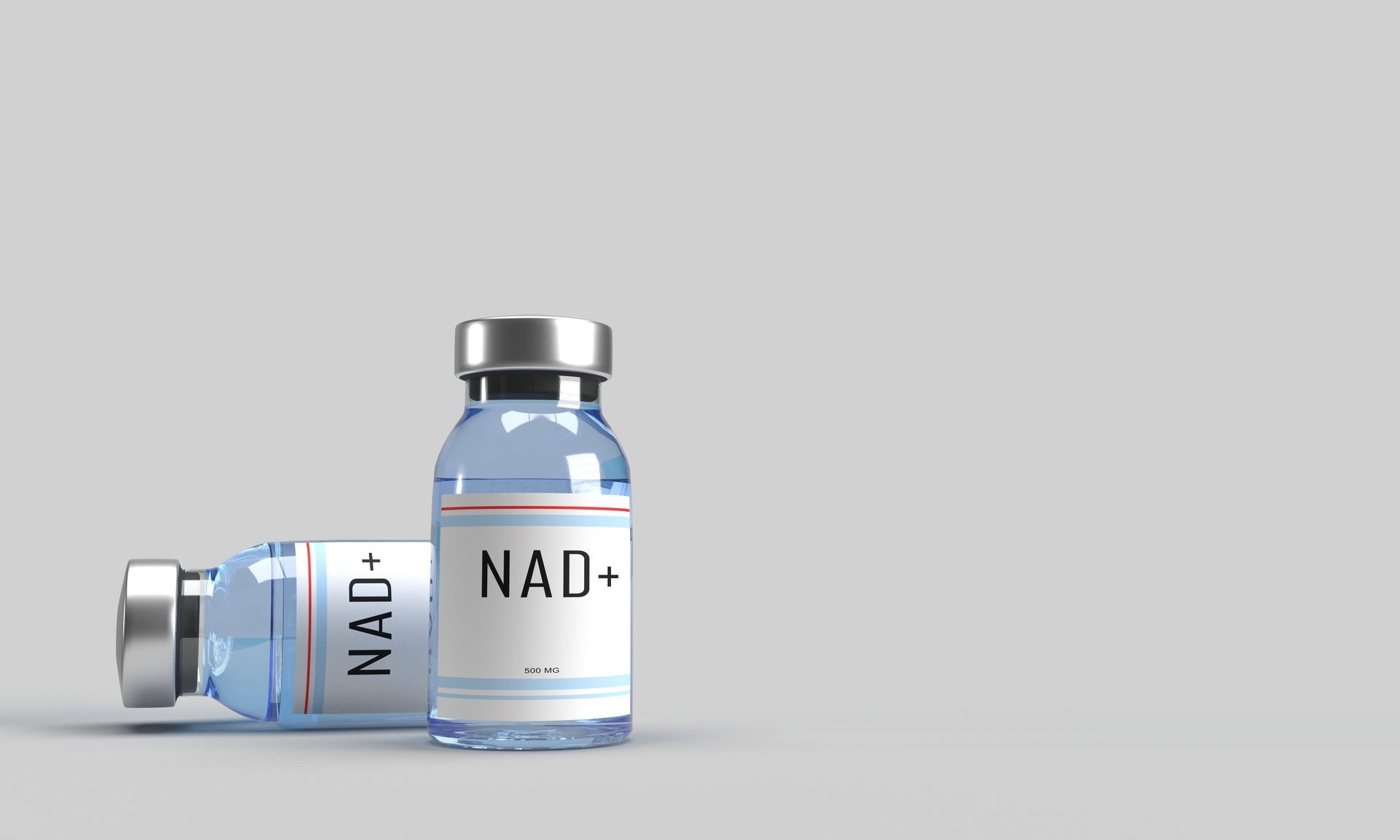 Two blue NAD+ supplement vials, one upright and one lying on its side, on a light gray background