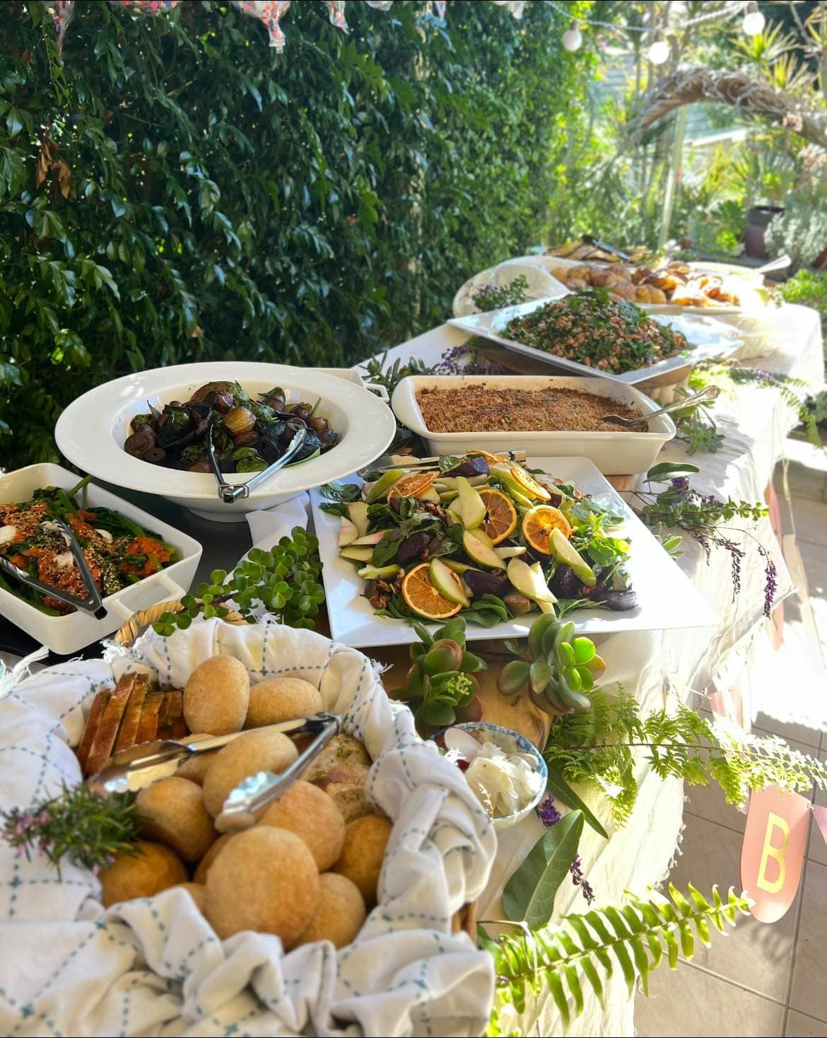 Buffet Table With Various Salads, Breads, and Dishes — Amanda Douglass Catering Service in Corlette, NSW