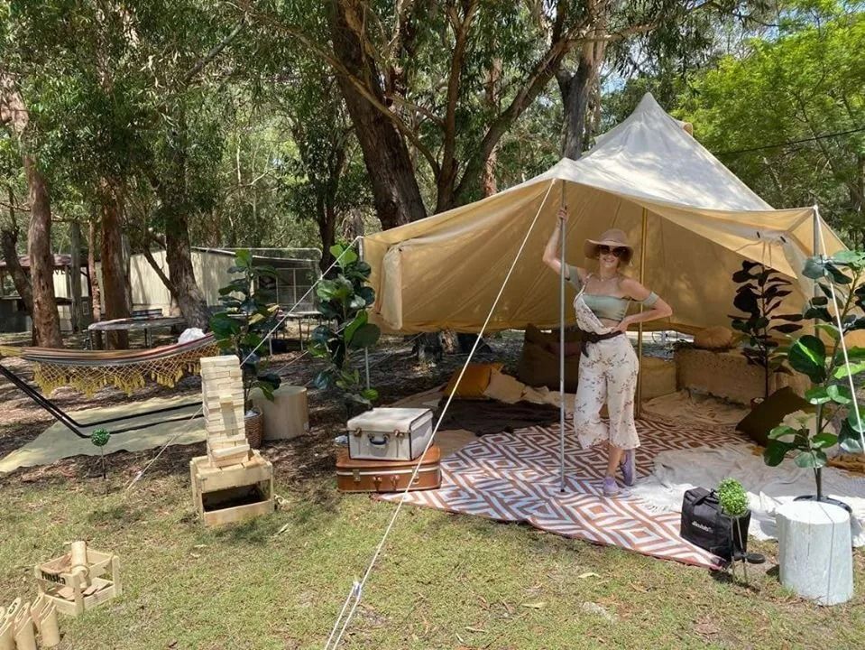 Chef Smiles, Standing Beside a Long Table of Food — Amanda Douglass Catering Service in Corlette, NSW