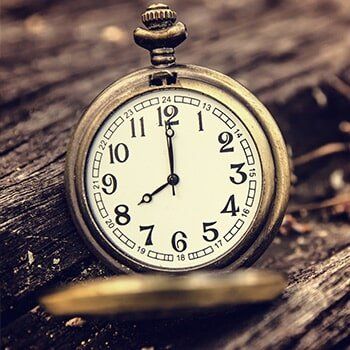 Antique watch in a wooden gap — jewelry store in Santa Barbara, CA