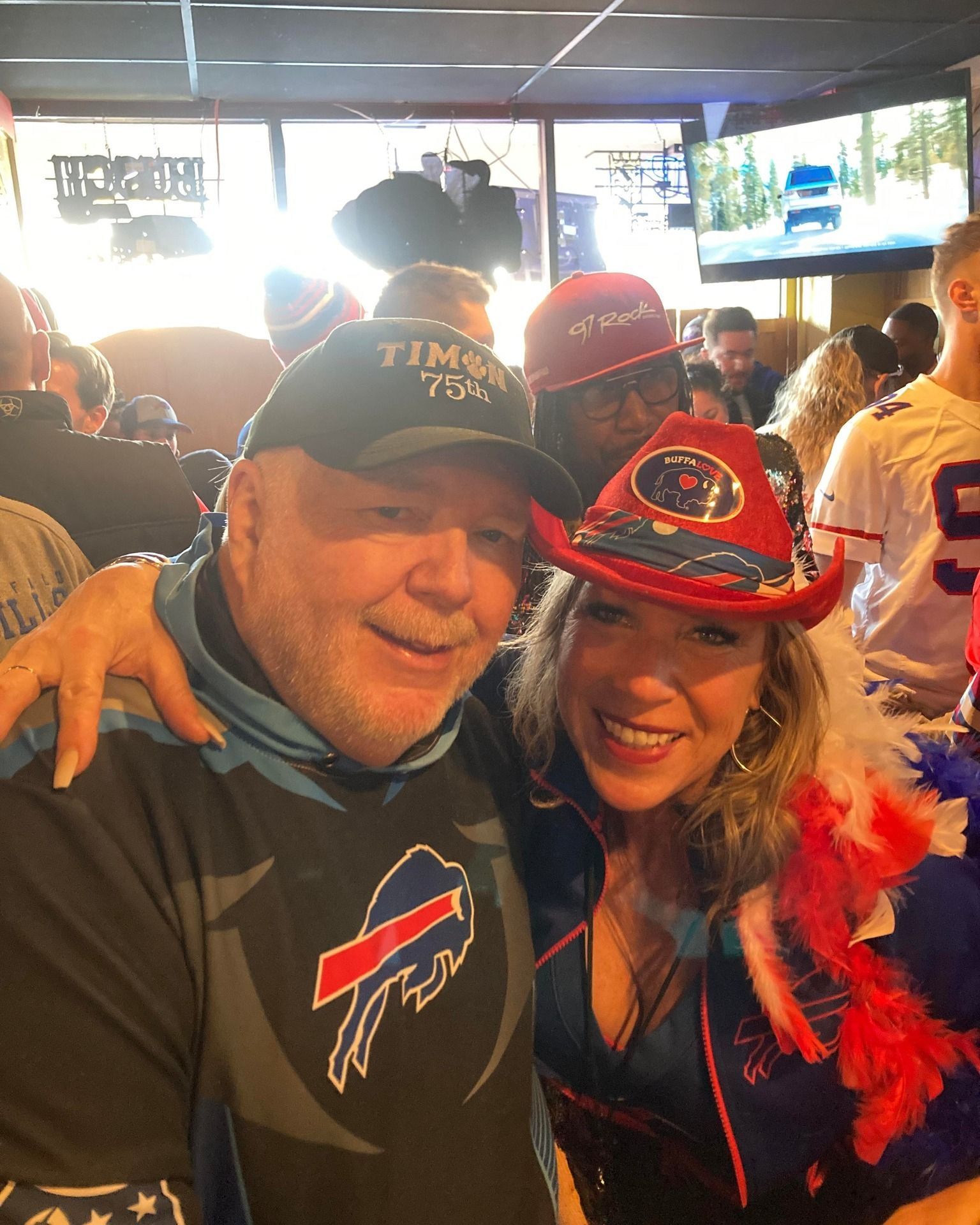 A man and a woman are posing for a picture together