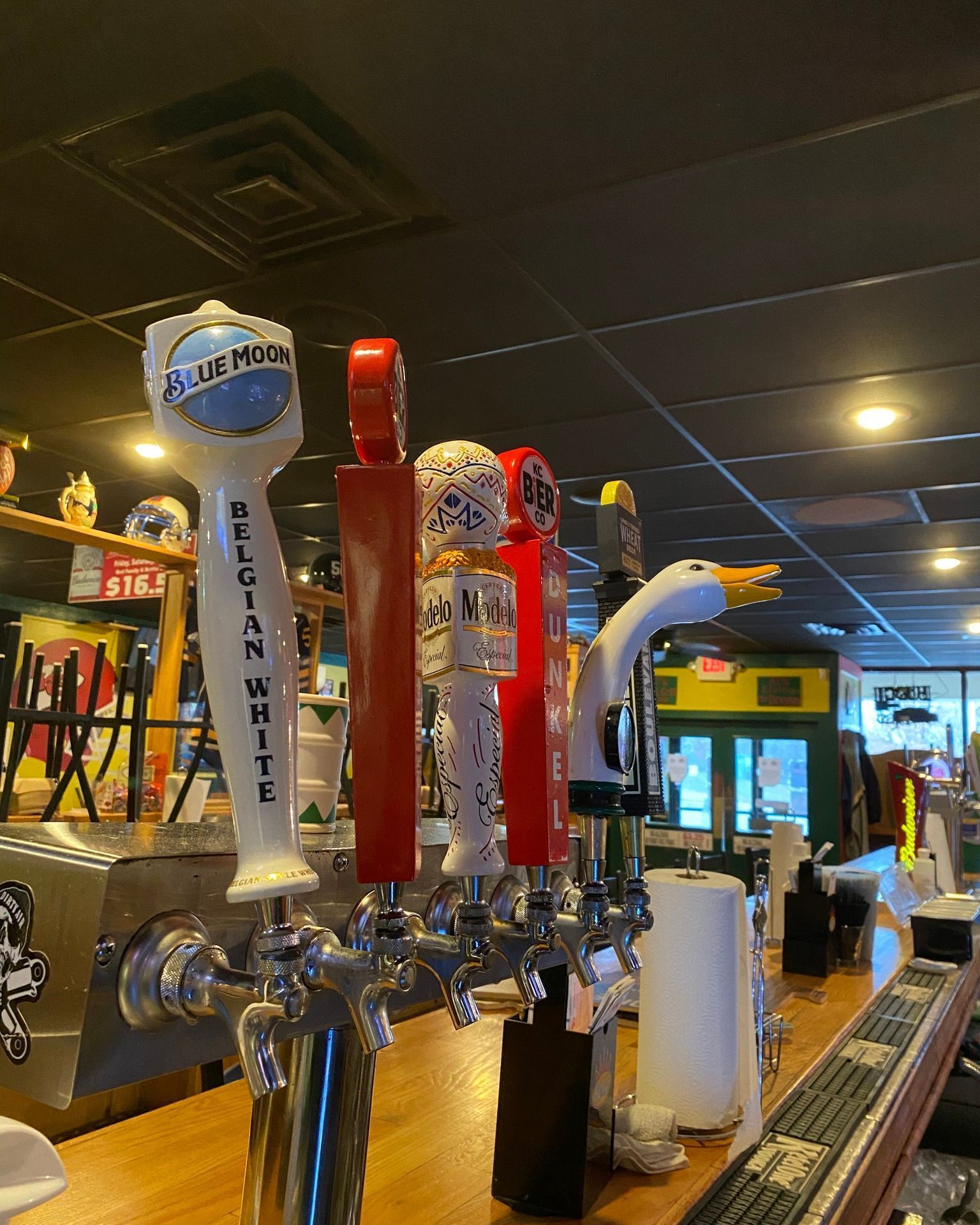 A bar with a lot of beer taps on it