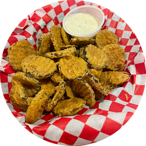 A basket of fried pickles with ranch dressing on a checkered paper.