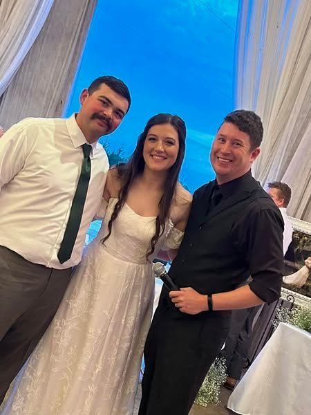 bride and groom with wedding dj