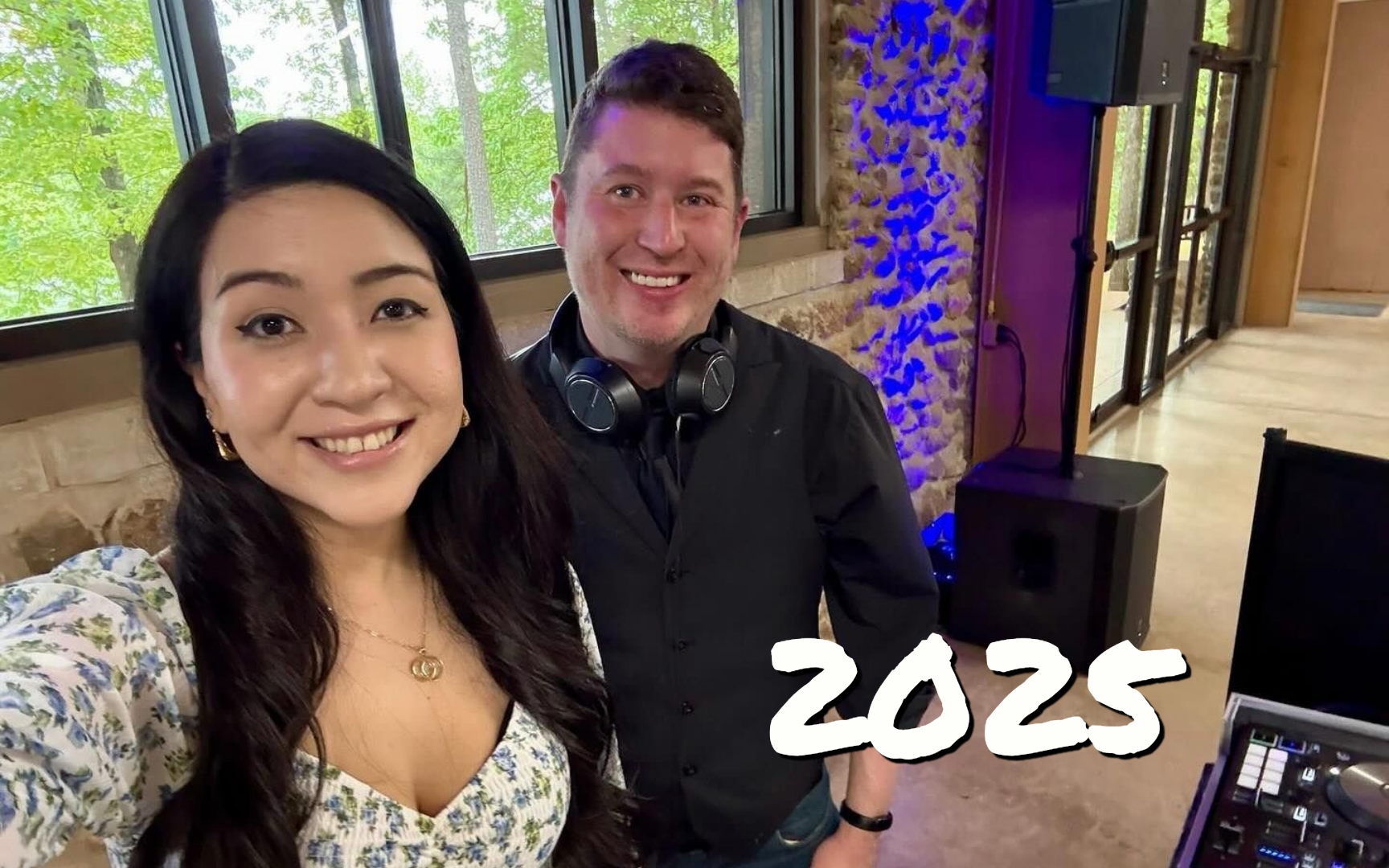 Two smiling people posing indoors, with “2025” text in the lower right.