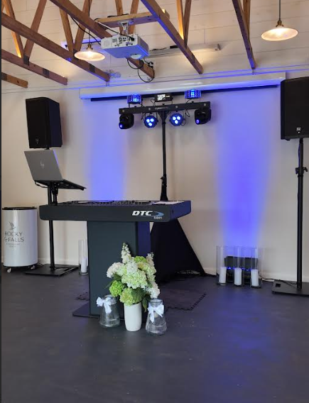 dj booth with speakers and lighting