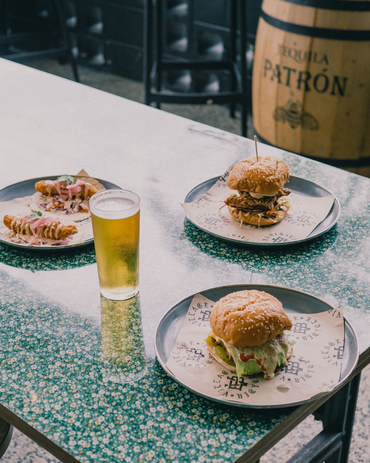 Table With A Lot of Tacos, Burgers and Beer — Village Bicycle Noosa in Noosa Heads, QLD