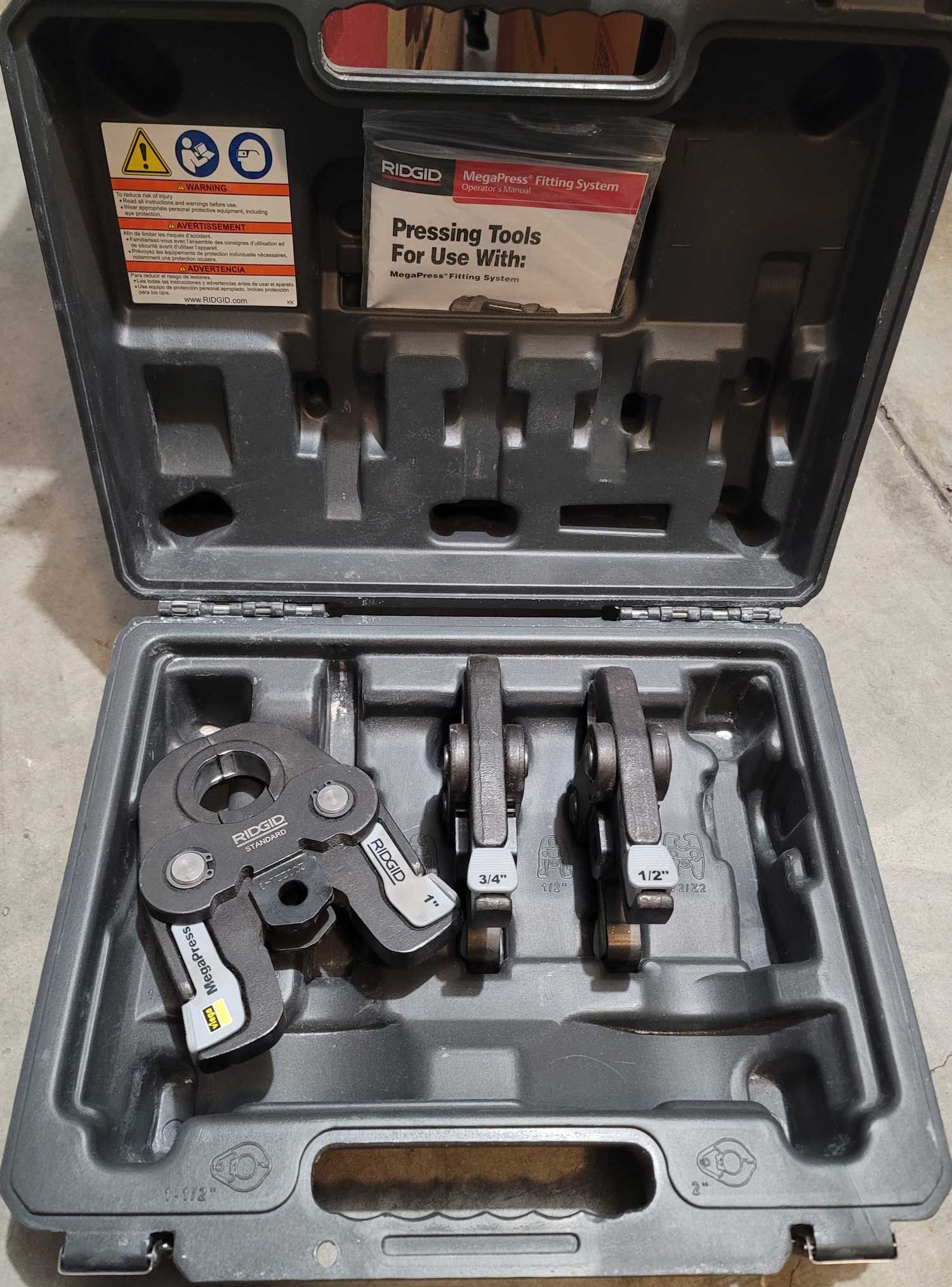 Tool case open with pressing tools for pipes. Includes jaws, case with documentation.
