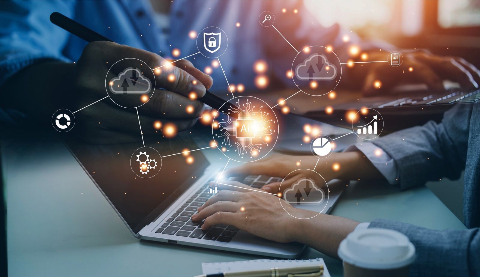 People working on a laptop, surrounded by digital cloud network icons.