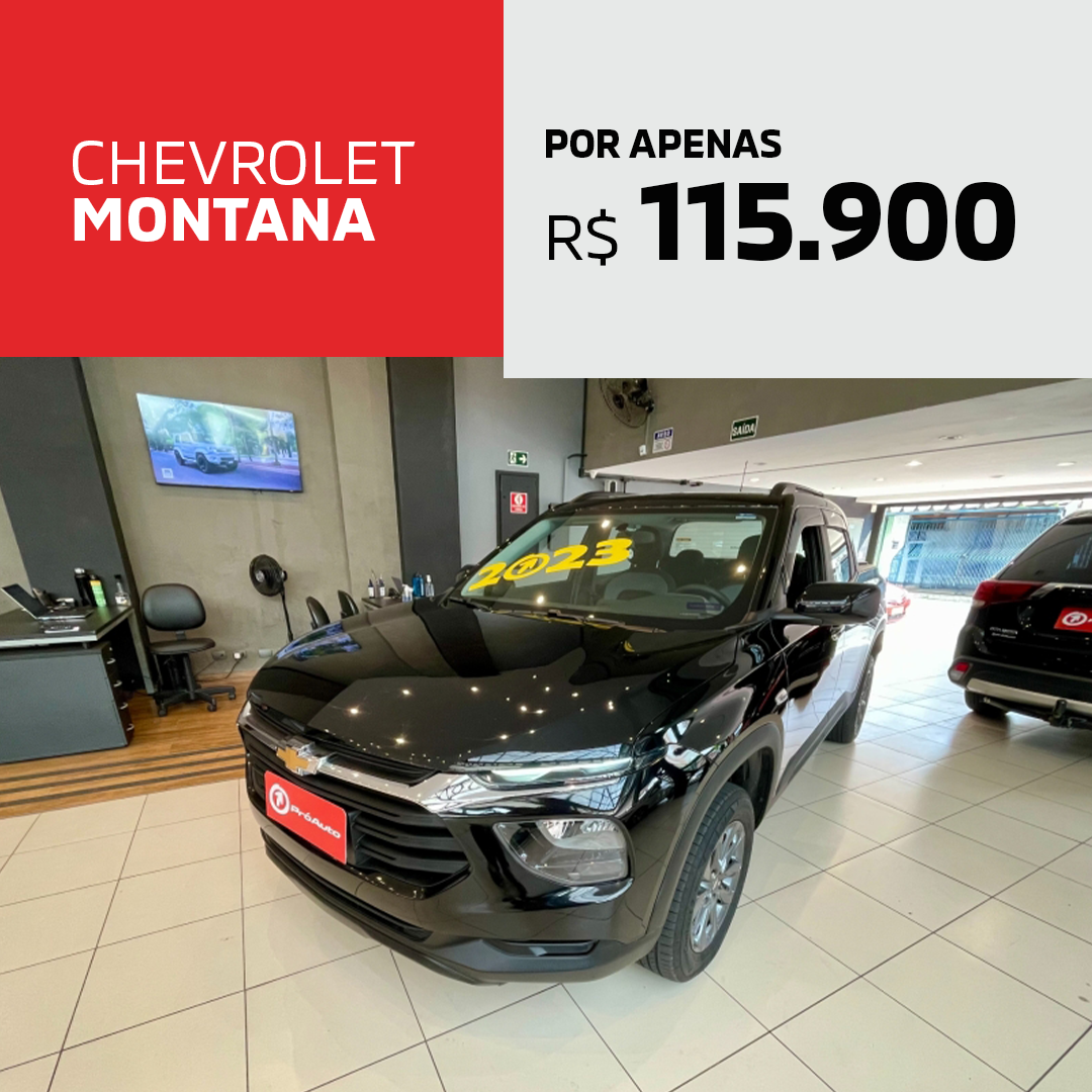 Um chevrolet montana preto está em um showroom