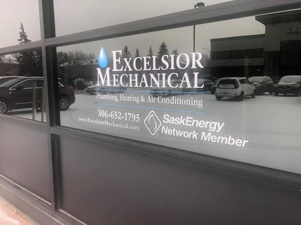 A window with the words excelsior mechanical written on it.