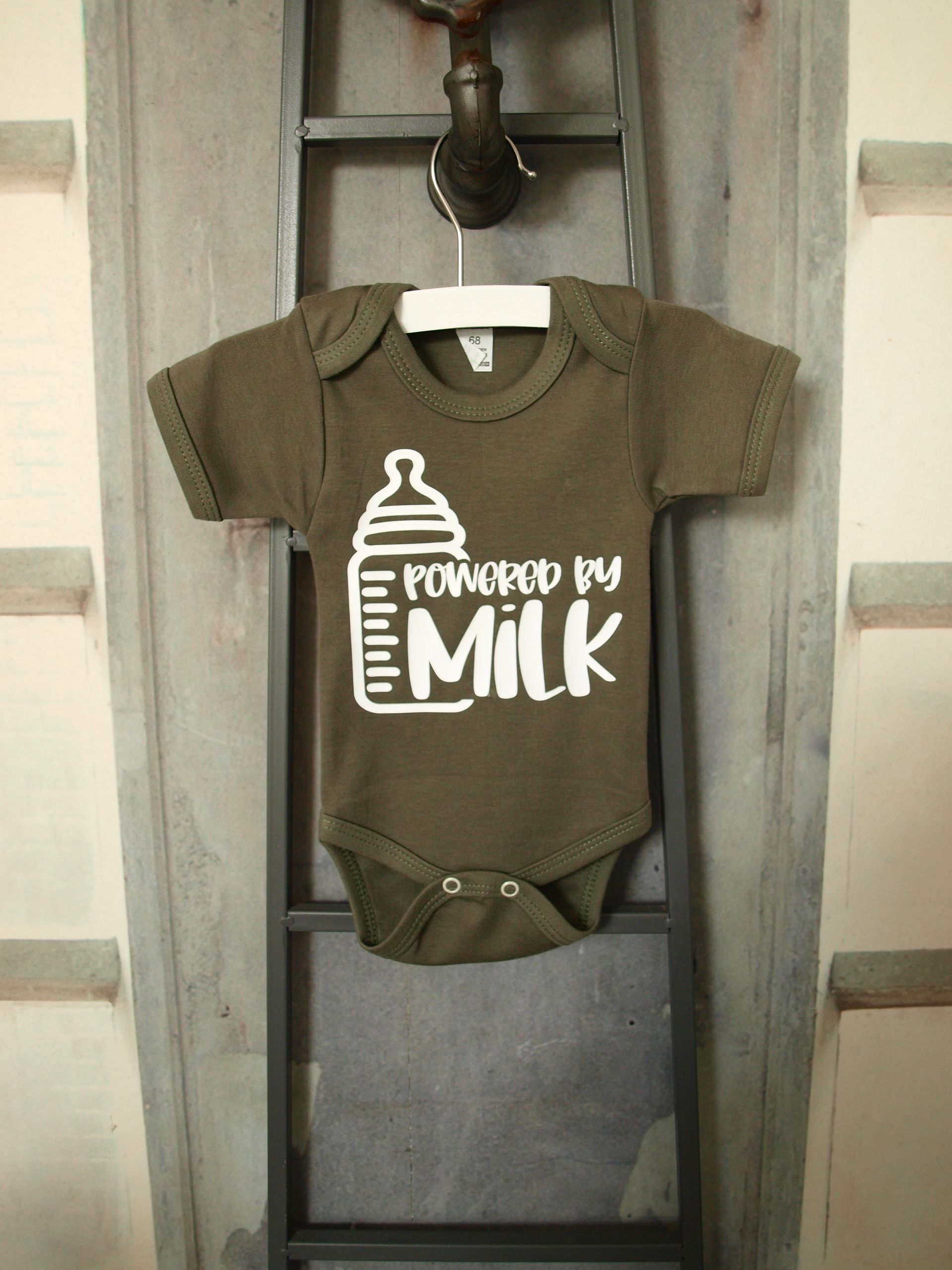 Grappige tekst op groen babyrompertje