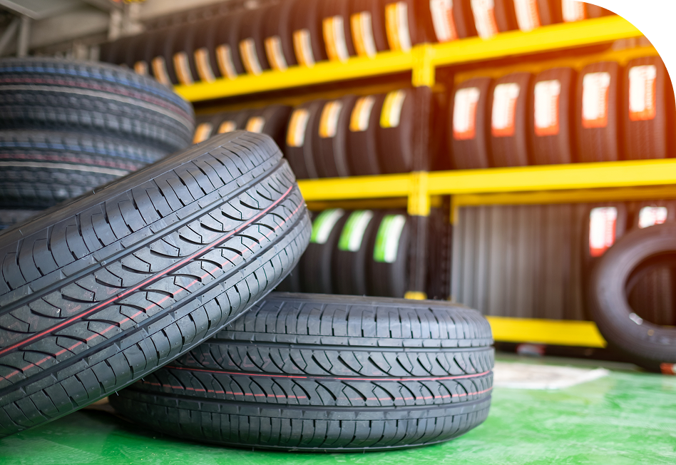 tires laying in front of tire shelf | Big Boyz Tire & Wheels