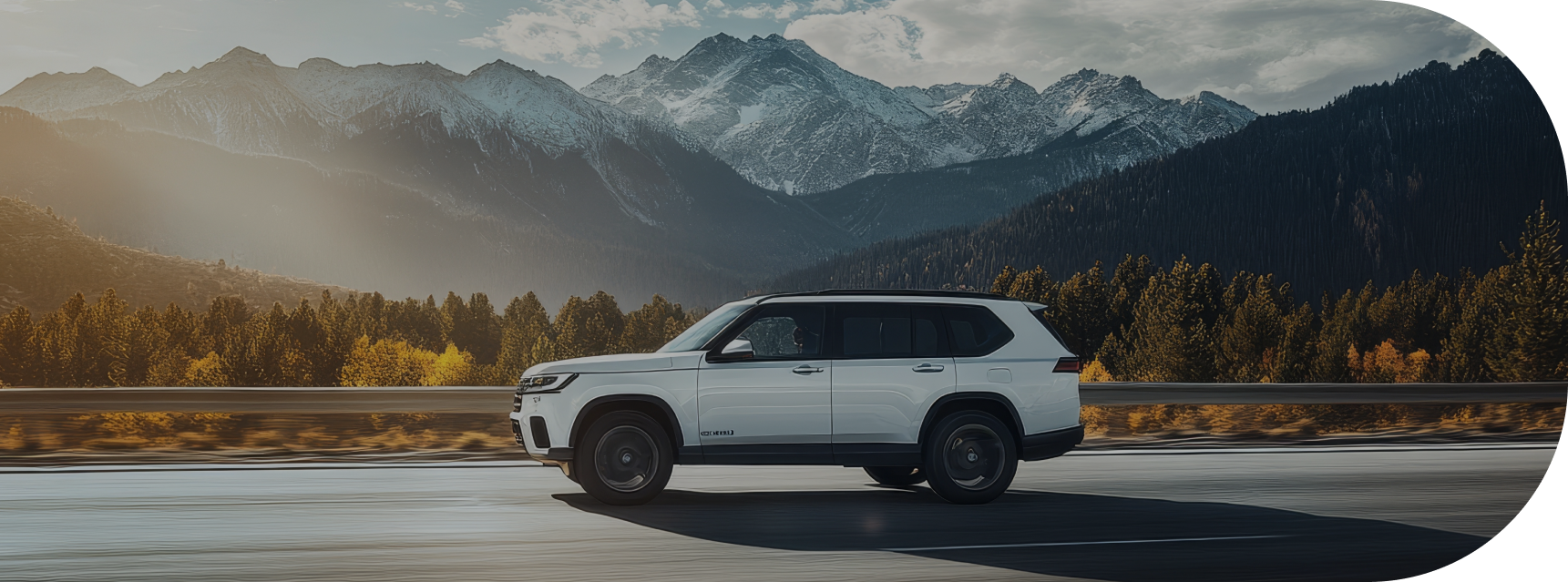 white suv driving on road in front of mountain | Big Boyz Tire & Wheels