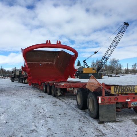 Truck Carrying Heavy Equipment — Gillette, WY — Black Hawk Crane & Rigging Inc