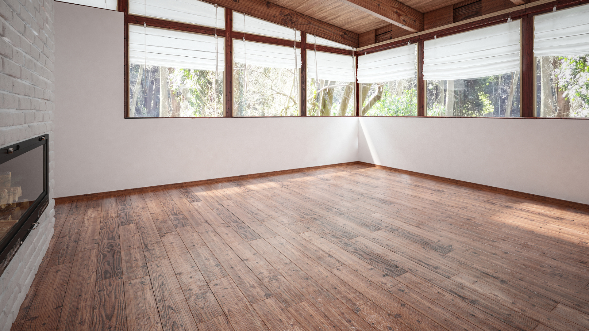 An empty living room with wooden floors and a fireplace.