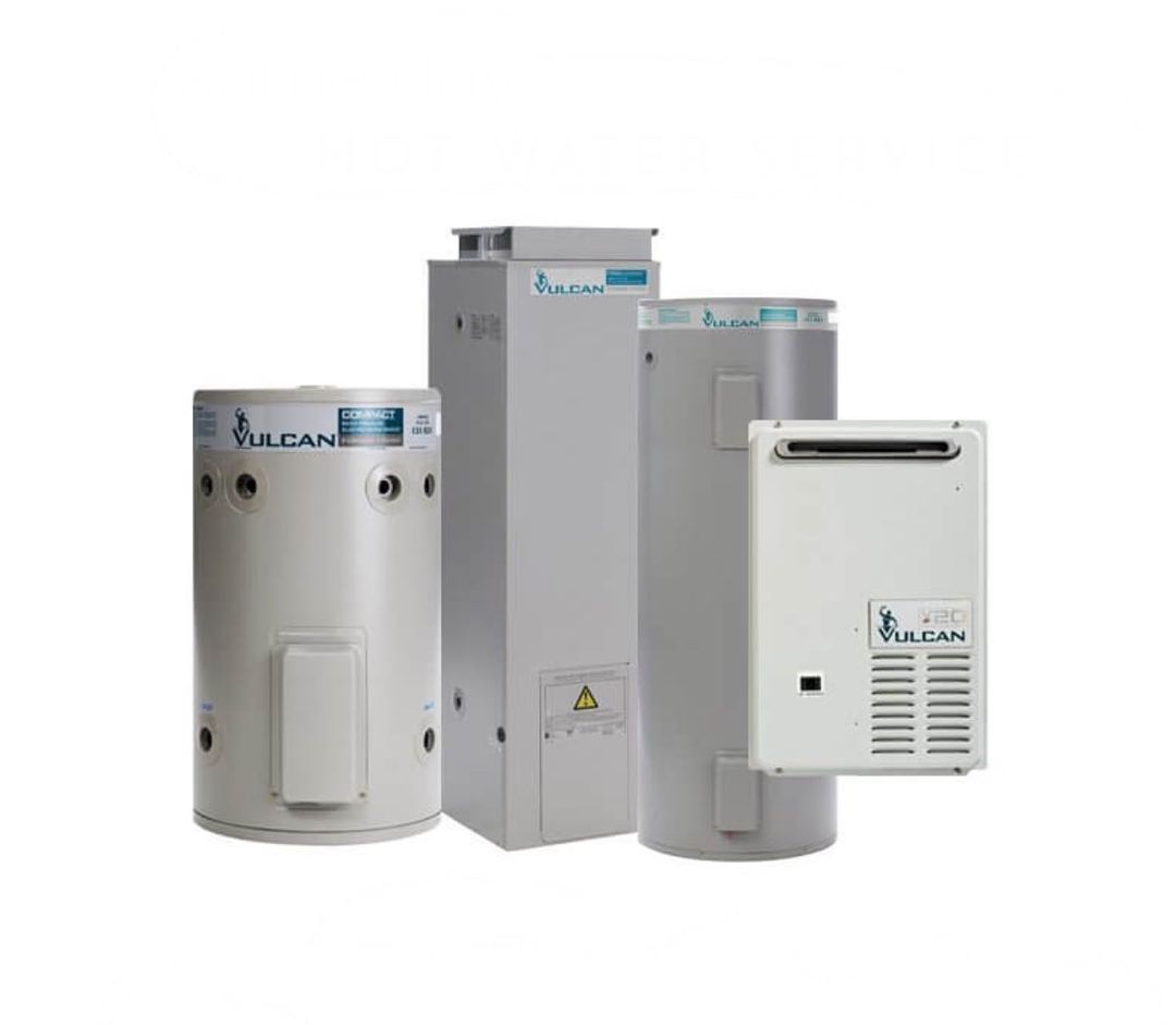 A White Boiler With Pipes Attached To It Is Hanging On A Wall — BAS Plumbing & Drainage In Forresters Beach, NSW