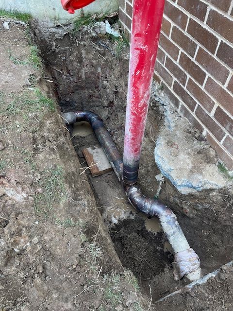 An Exposed Pipe Underground Being Fixed — BAS Plumbing & Drainage In Avoca Beach, NSW