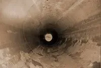 a cleaned out drain pipe after removing tree roots