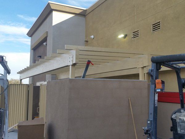 A forklift is parked in front of a building