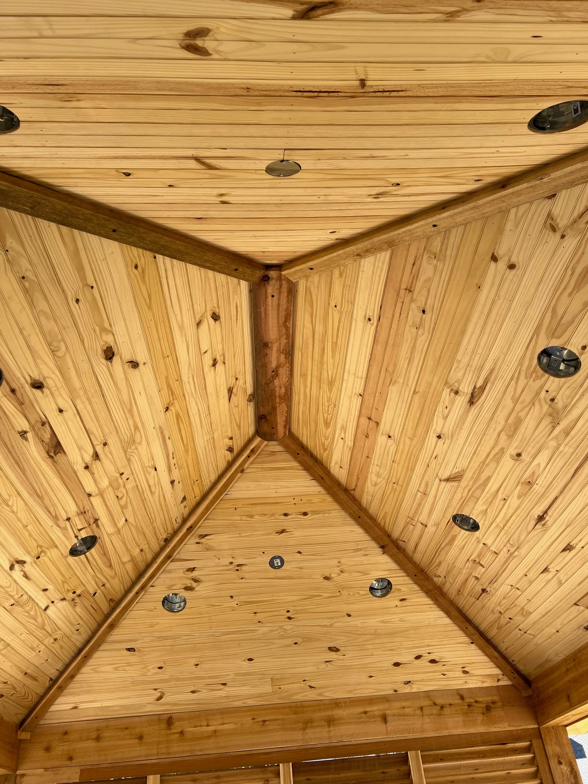 A close up of a wooden ceiling in a building.