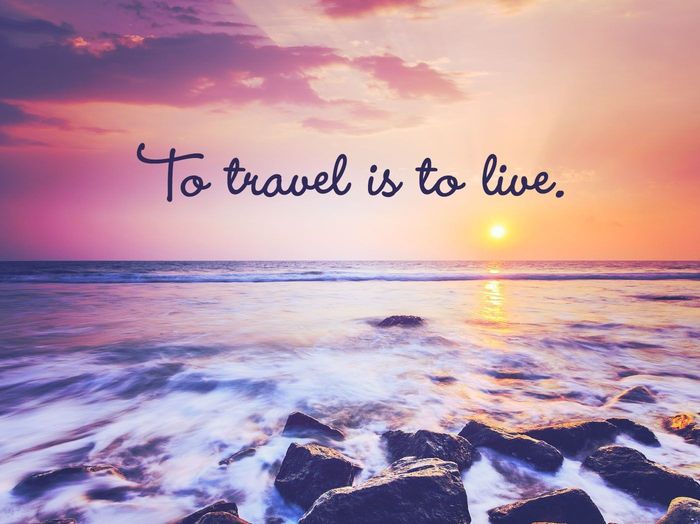 A picture of a beach with the words to travel is to live