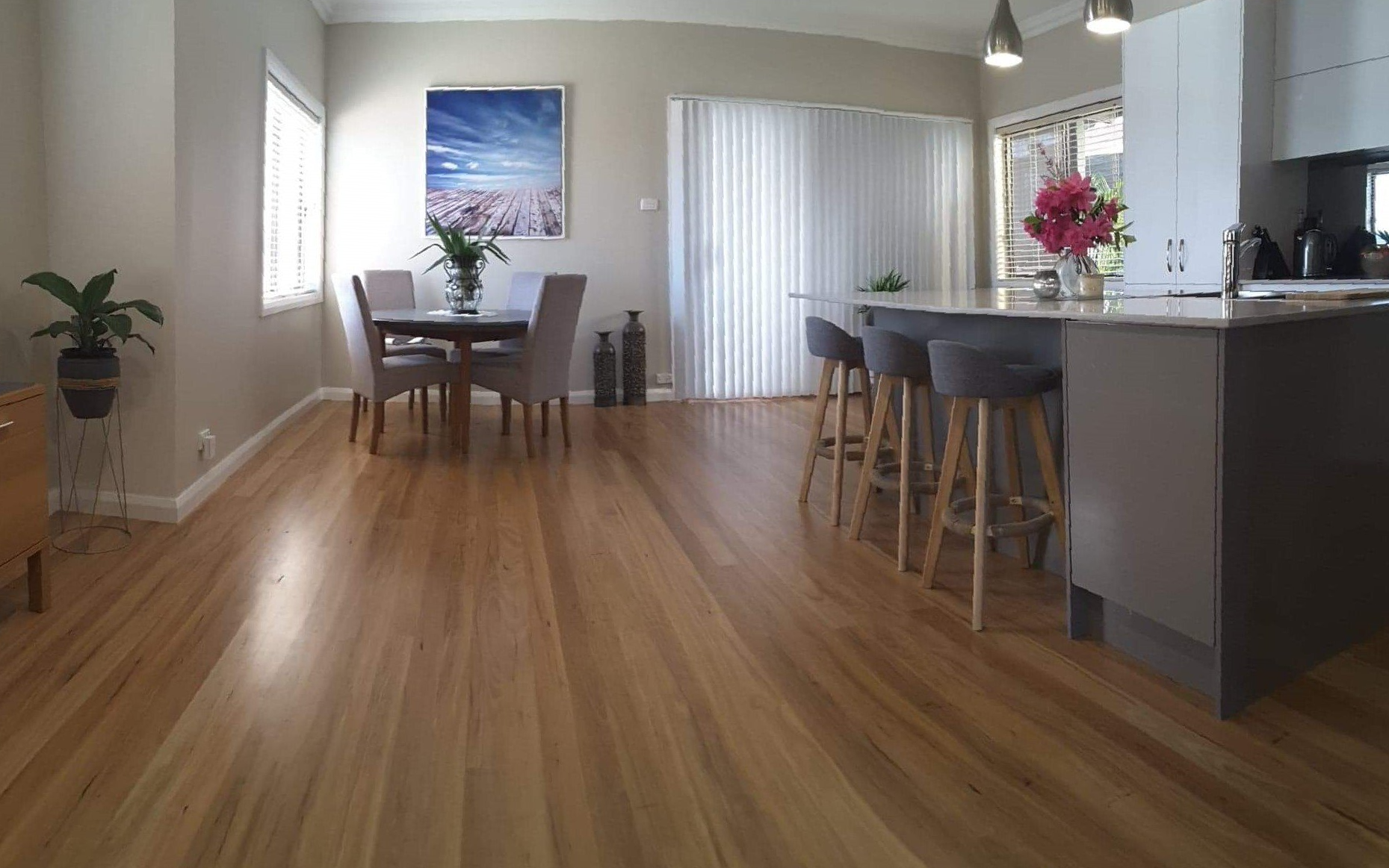 Worker Measuring Timber Floor — WJM Timber Floors In Newcastle, NSW