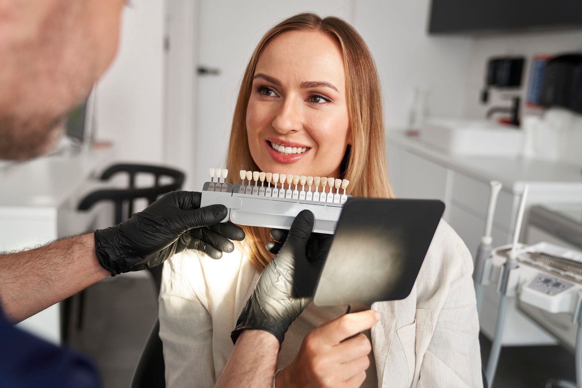 Person smiling at a dentist.