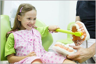 Girl in dentists chair — Pediatric Dentistry in Glen Mills, PA