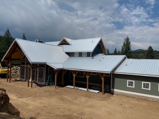 Large house with a metal roof is being built – Evergreen, CO - Elevated Roofing