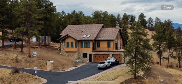 A spacious residence perched atop a hill enveloped by lush trees – Evergreen, CO - Elevated Roofing