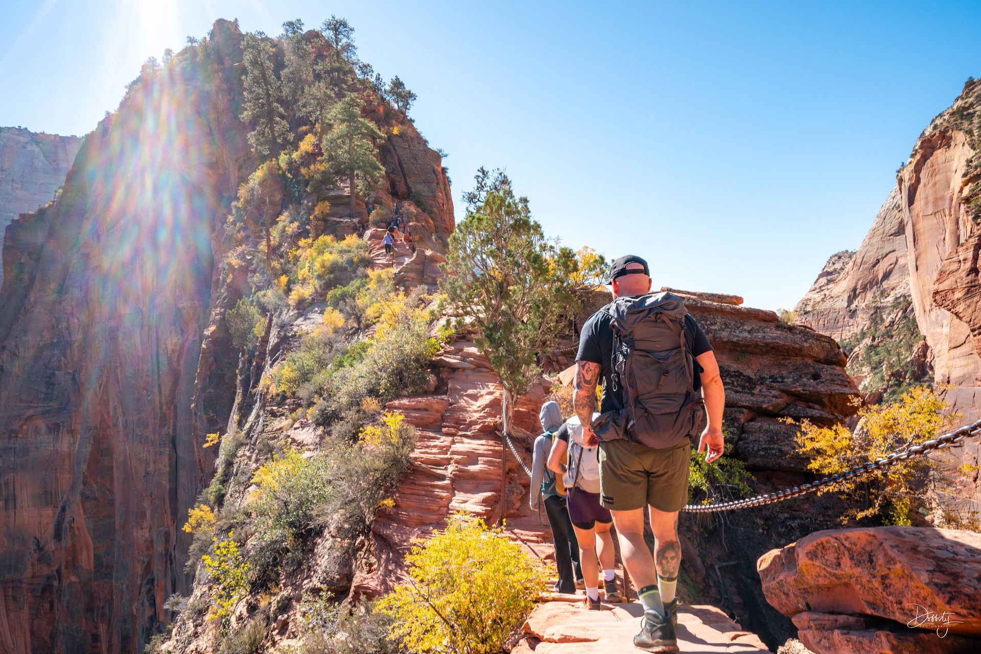 Hikers hiking Americas most dangerous trail, Angels Landing in Zion National Park