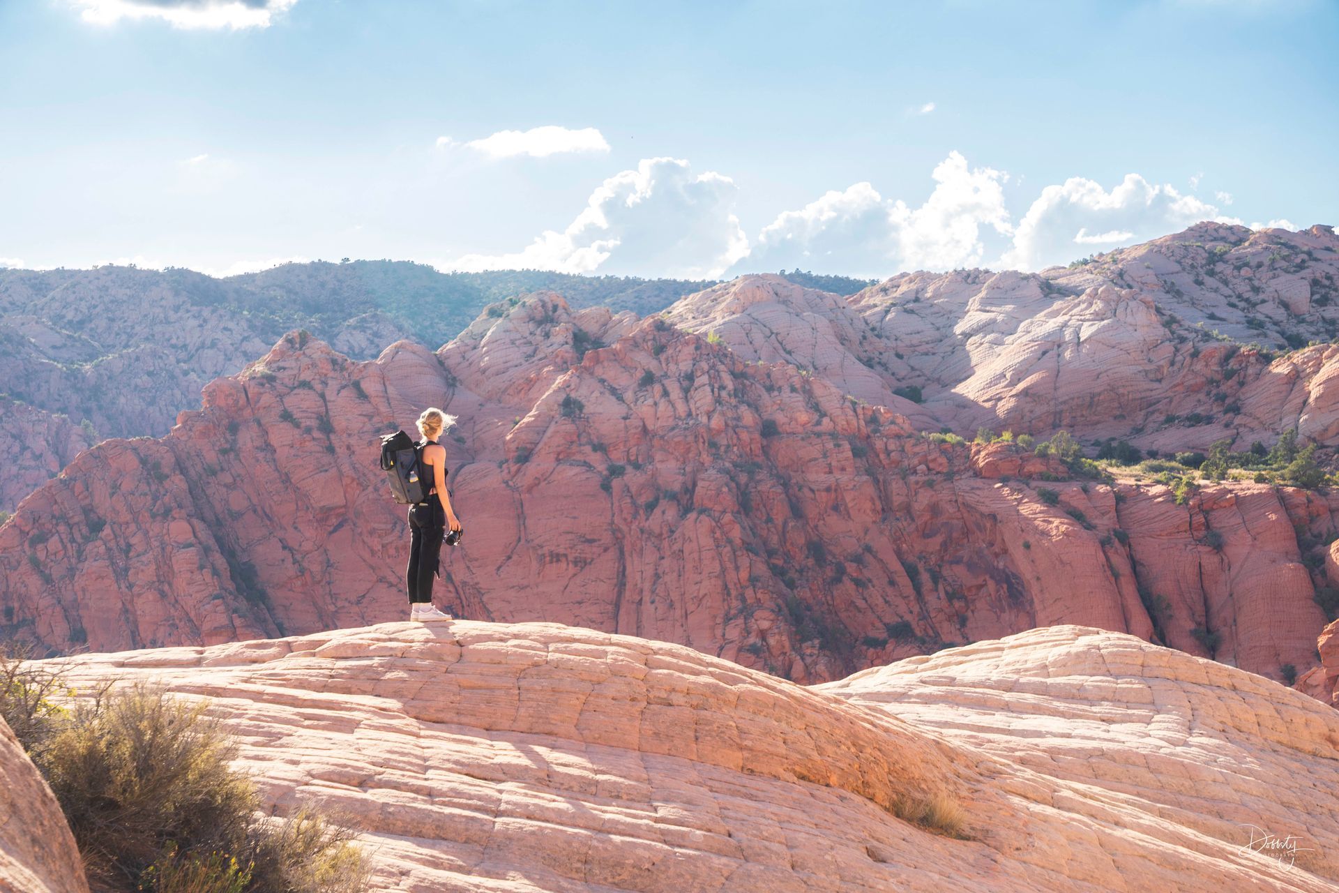 A hiker taking in the view at the less visited Yant Flat in Saint George, Utah