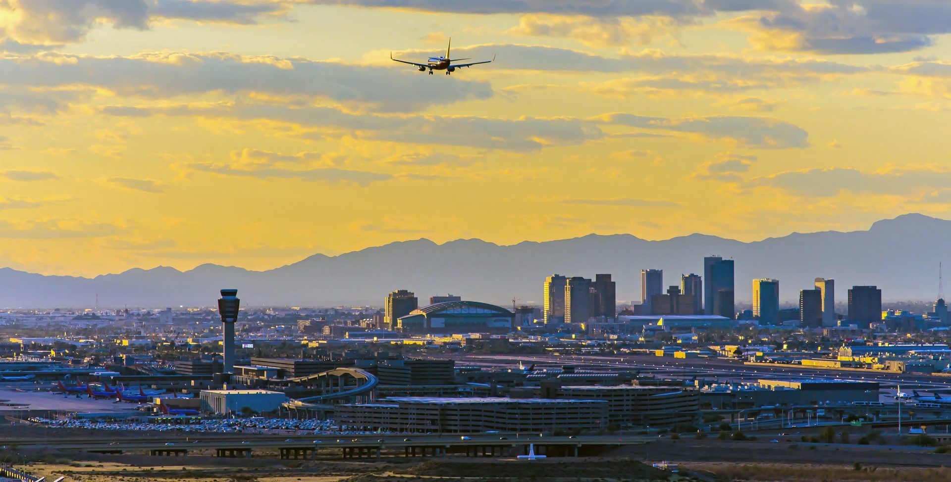 Airplane taking off over the beautiful sunset in Phoenix Arizona 